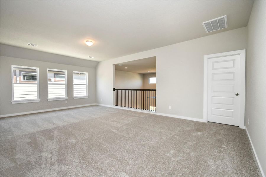 Take a look this spacious game room, perfect for family or friends game nights! Sample photo of completed home with similar floor plan. Actual colors and selections may vary.