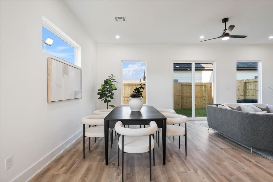 The home features a designated dining area, ideal for family meals or entertaining guests. Its placement within the open layout keeps it connected to the kitchen and living spaces while maintaining a sense of intimacy. This thoughtful design makes every meal feel welcoming and special.