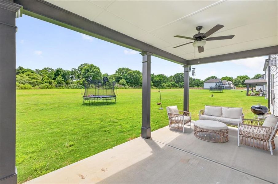 Exterior details and patio area of a home in Porches at Mobley Lake, Dacula (Image 25).