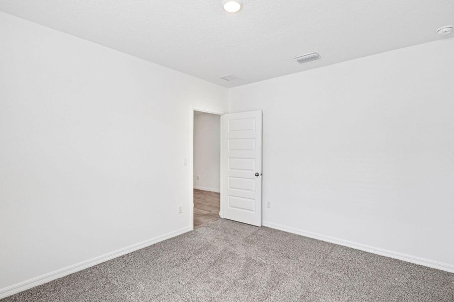 Spacious, unfurnished interior of a new home in Hampton Park - Classic Series, Vero Beach (Image 17).