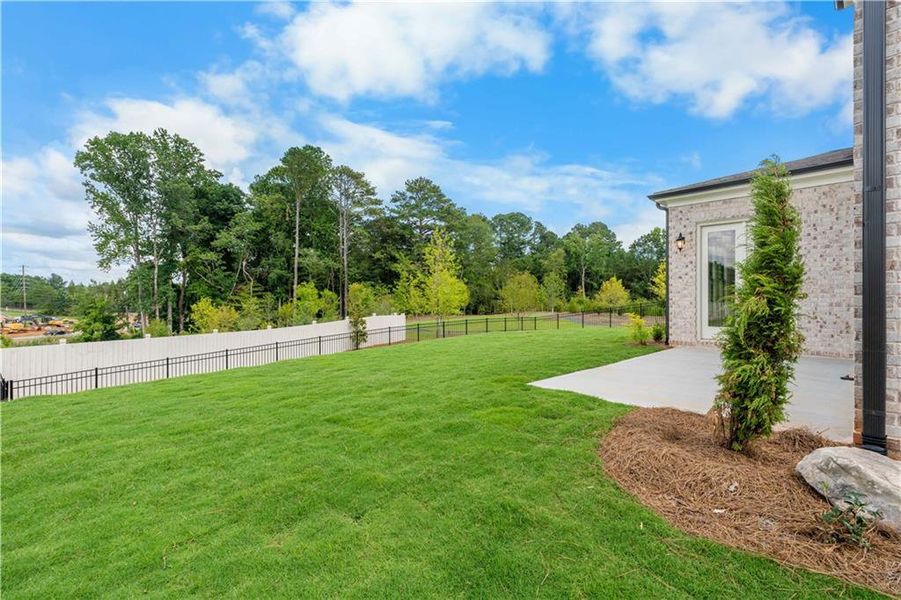 Front exterior of a new home in Knollwood, Johns Creek, GA, highlighting curb appeal (Image 2).