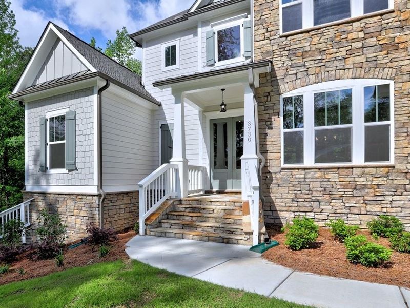 Front exterior of a new home in Chattahoochee Reserve, Cumming, GA, highlighting curb appeal (Image 12). Front exterior of a new home in Chattahoochee Reserve, Cumming, GA, highlighting curb appeal (Image 12).
