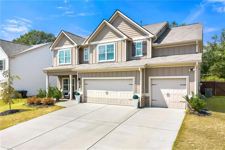 Front exterior of a new home in , Loganville, GA, highlighting curb appeal (Image 19).