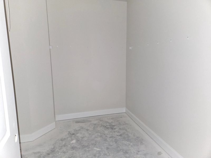 Primary Bathroom Walk-in Closet Primary Bathroom Walk-in Closet