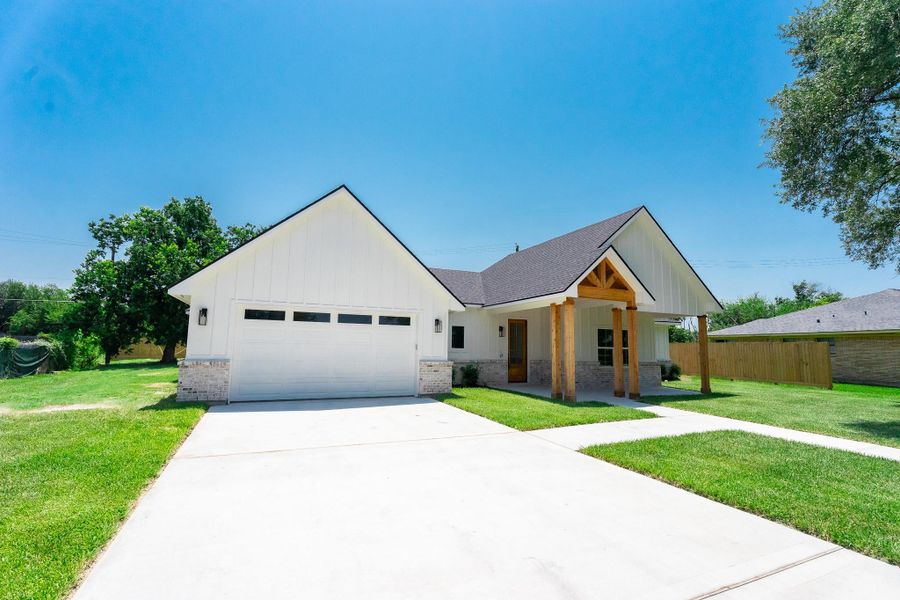 Front exterior of a new home in , Pasadena, TX, highlighting curb appeal (Image 24).