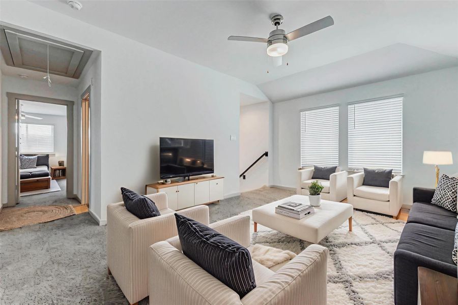 Natural light floods this upstairs bonus space, ideal for a media zone, play area, or reading nook. The layout allows for flexible use, with close proximity to bedrooms and the convenience of a central hallway just beyond. Natural light floods this upstairs bonus space, ideal for a media zone, play area, or reading nook. The layout allows for flexible use, with close proximity to bedrooms and the convenience of a central hallway just beyond.