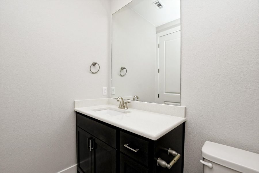 Representative furnished interior of a home built from the Vanderpool II by Giddens Homes in Whispering Wind, Bertram (Image 19).