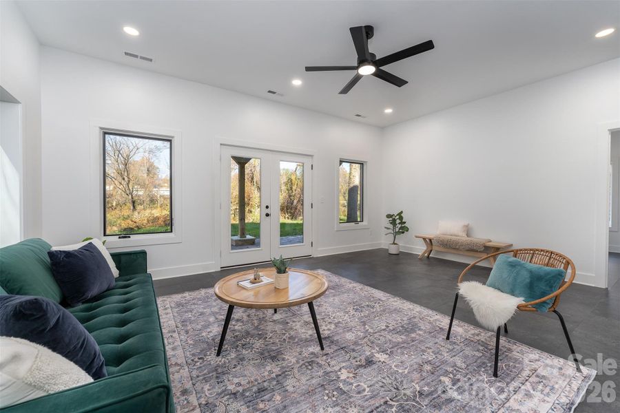 ower level flex space with tons of light looking out to the covered patio