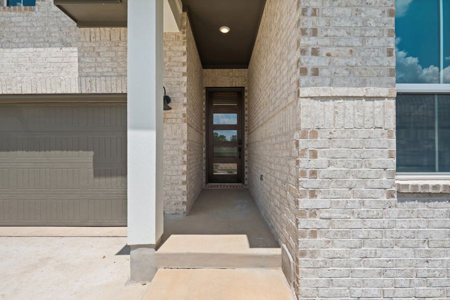 Exterior details and patio area of a home in Arbor Collection At Wolf Ranch, Georgetown (Image 3).