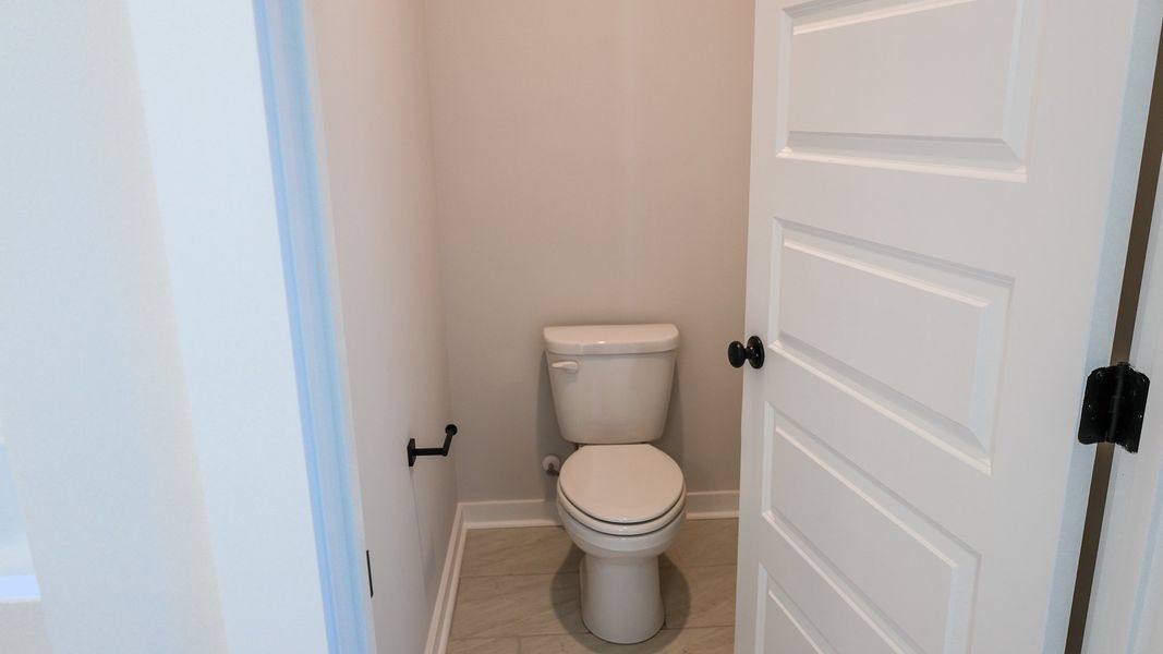 Representative furnished interior of a home built from the TISDALE by D.R. Horton in Harvest Point, Spring Hill (Image 7).