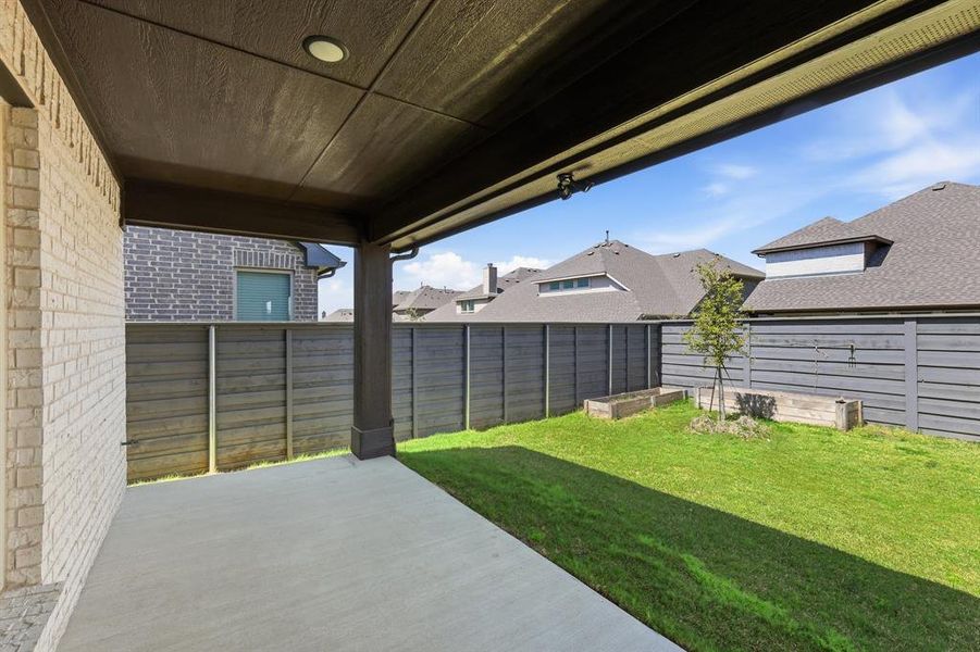 Exterior details and patio area of a home in Union Park, Little Elm (Image 3). Exterior details and patio area of a home in Union Park, Little Elm (Image 3).