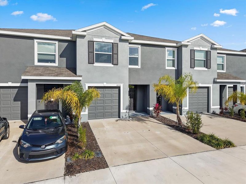 Front exterior of a new home in , Wesley Chapel, FL, highlighting curb appeal (Image 21).