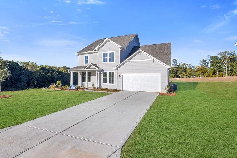 Front exterior of a new home in Pickens Bluff, Hiram, GA, highlighting curb appeal (Image 2). Front exterior of a new home in Pickens Bluff, Hiram, GA, highlighting curb appeal (Image 2).
