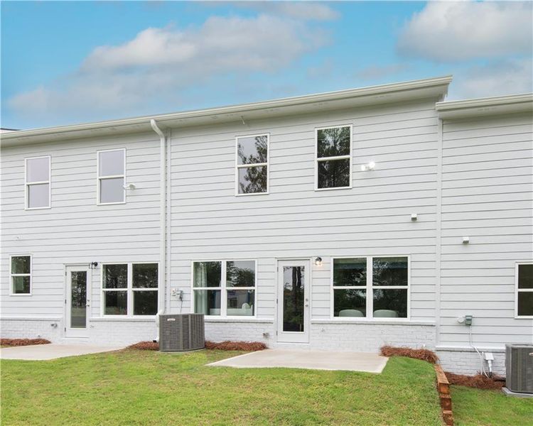 Front exterior of a new home in Old Salem Crossing, Conyers, GA, highlighting curb appeal (Image 1).