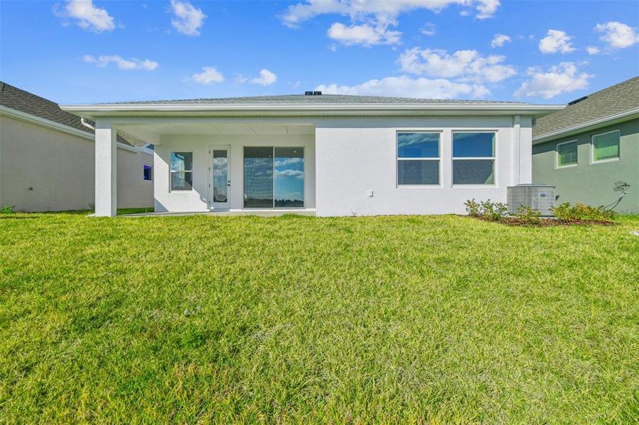 Exterior details and patio area of a home in The Peninsula at Rhodine Lake, Riverview (Image 29).
