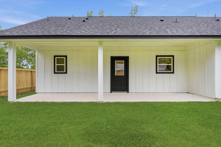Large backyard fully fenced with covered patio and double gate