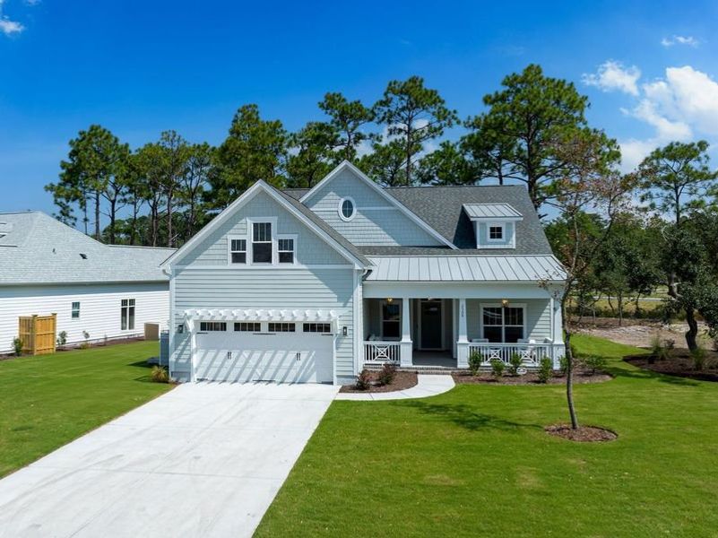 Front exterior of a new home in Osprey Landing, Southport, NC, highlighting curb appeal (Image 2).