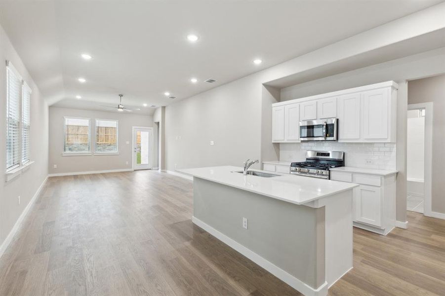 Open living space in in the Elm home plan by Trophy Signature Homes – REPRESENTATIVE PHOTO