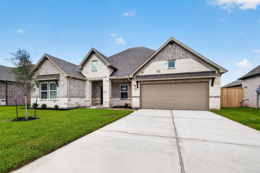 Front exterior of a new home in Foxtail Palms, Manvel, TX, highlighting curb appeal (Image 22).