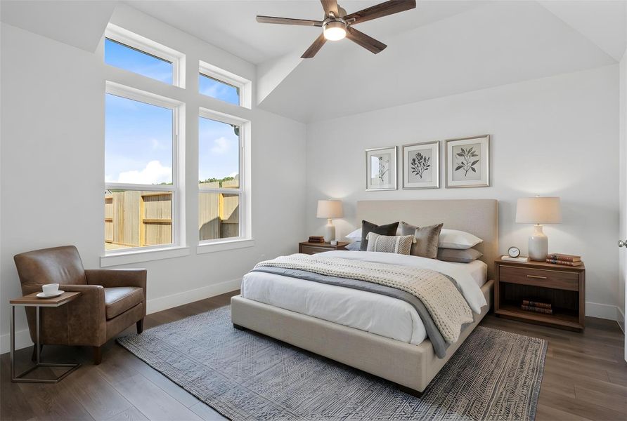 Retreat to this bright and airy primary bedroom, a serene sanctuary designed for ultimate relaxation and comfort. Vaulted ceilings, large windows, stylish laminate flooring, and modern ceiling fan give this room a peaceful space to come home to. *Virtually Staged Retreat to this bright and airy primary bedroom, a serene sanctuary designed for ultimate relaxation and comfort. Vaulted ceilings, large windows, stylish laminate flooring, and modern ceiling fan give this room a peaceful space to come home to. *Virtually Staged