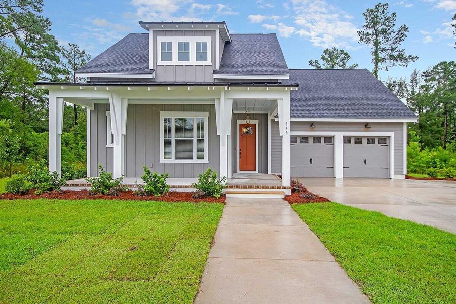 Front exterior of a new home in Point Hope - Village Collection, Charleston, SC, highlighting curb appeal (Image 1).