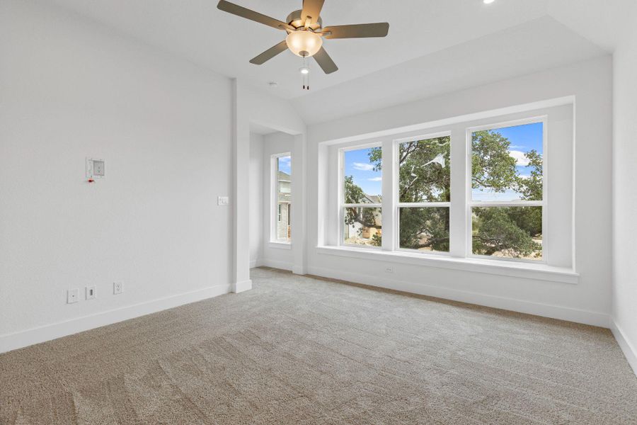 Primary Bedroom with elevated ceiling