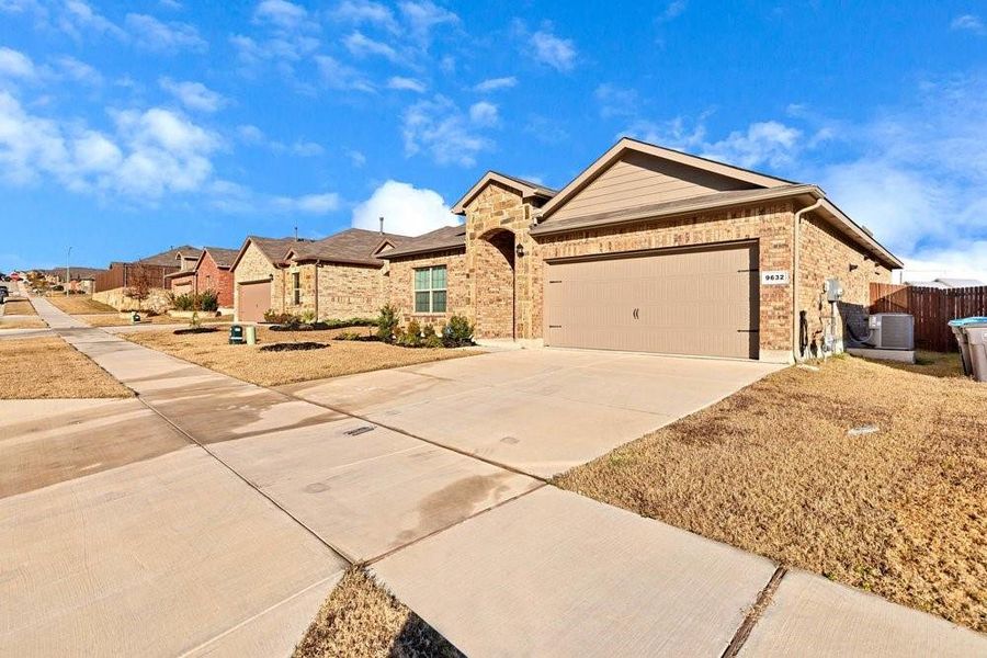 2 car garage, stone and brick exterior 2 car garage, stone and brick exterior