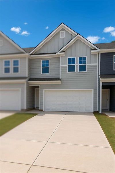 Front exterior of a new home in Rivershire Place, Villa Rica, GA, highlighting curb appeal (Image 21).