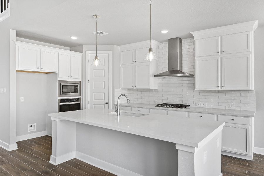 Furnished interior view inside a new home in Sunterra, Katy (Image 7).