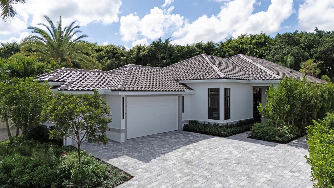 Front exterior of a new home in , Wellington, FL, highlighting curb appeal (Image 1).