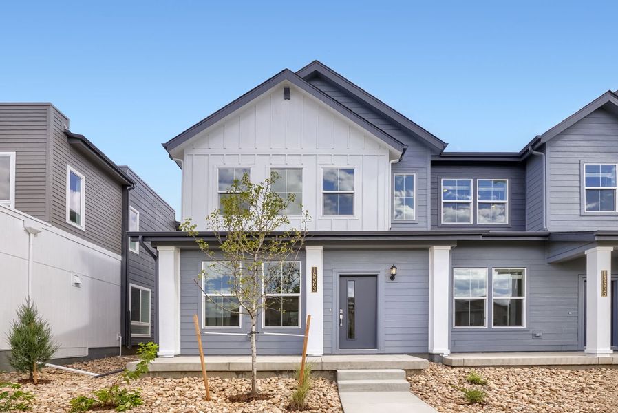 Front exterior of a new home in Newlin Crossing, Parker, CO, highlighting curb appeal (Image 1). Front exterior of a new home in Newlin Crossing, Parker, CO, highlighting curb appeal (Image 1).