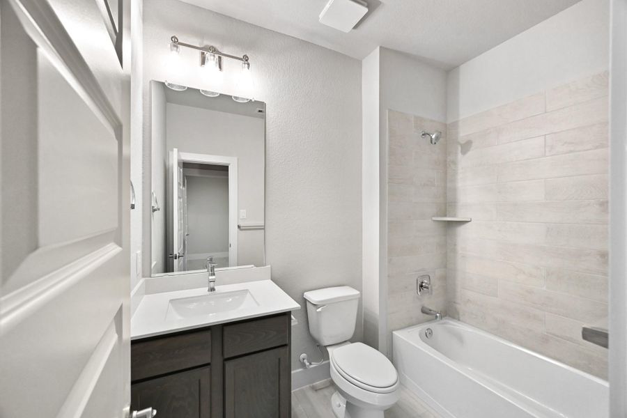 Furnished interior view inside a new home in Barton Creek Ranch, Conroe (Image 5).