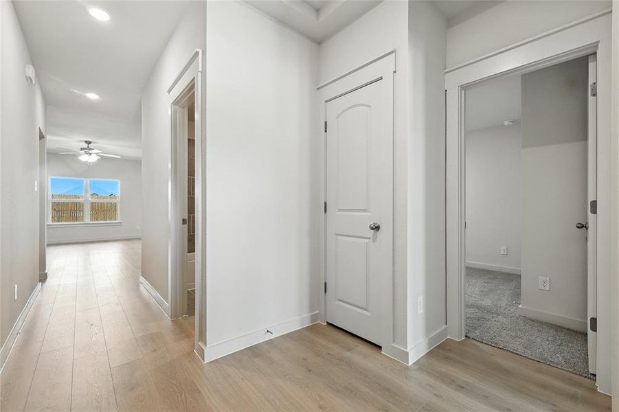 Hall with recessed lighting and light wood-type flooring Hall with recessed lighting and light wood-type flooring