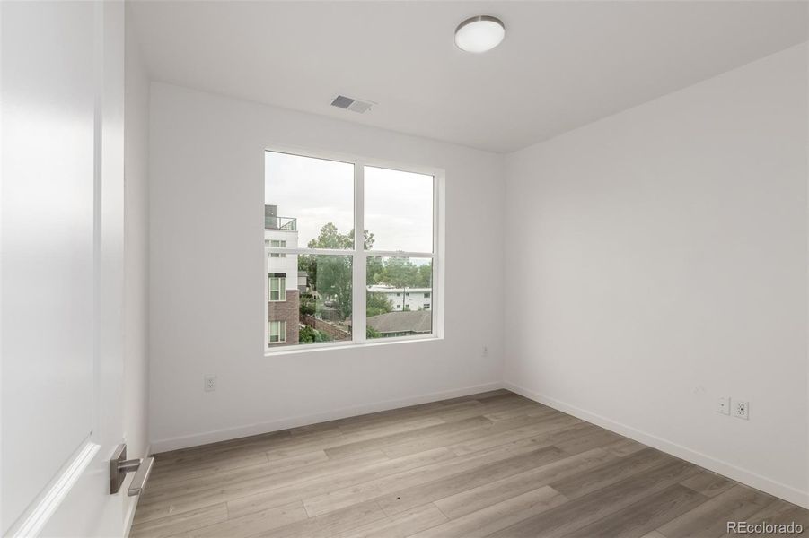 Spacious, unfurnished interior of a new home in The Scene at Sloan's Lake, Denver (Image 7).