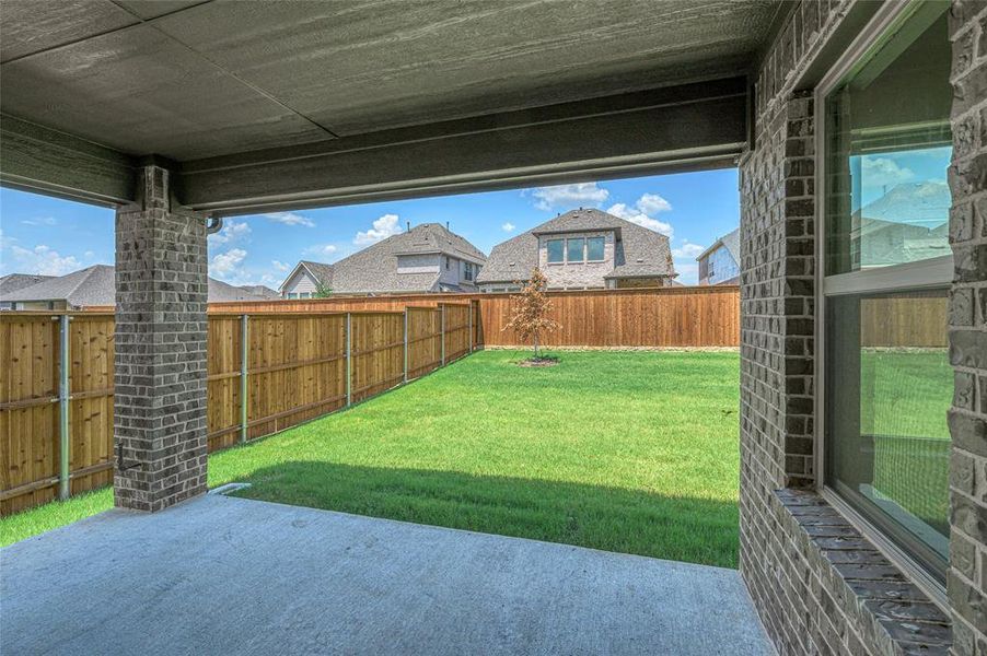 Exterior details and patio area of a home in Creekview Meadows, Pilot Point (Image 22).