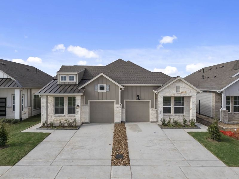 Front exterior of a new home in Meridiana, Manvel, TX, highlighting curb appeal (Image 16).