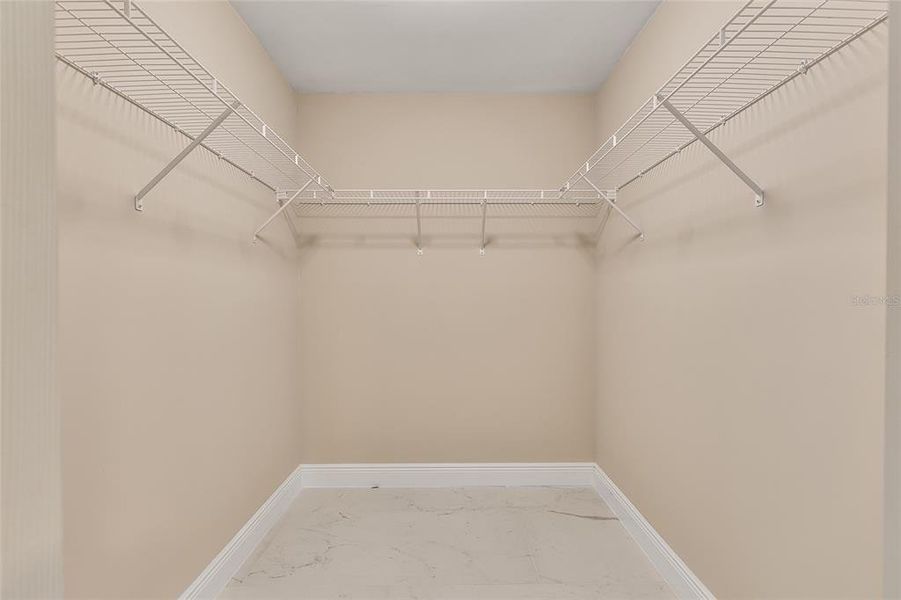 Walk in closet in guest bathroom