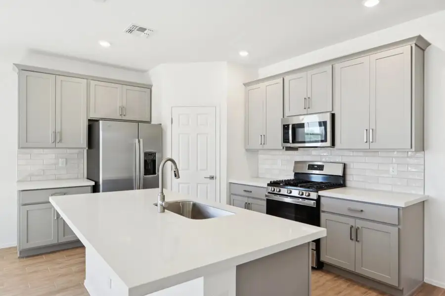 Kitchen featuring the Milan Collection. Not actual home, finishes may vary.