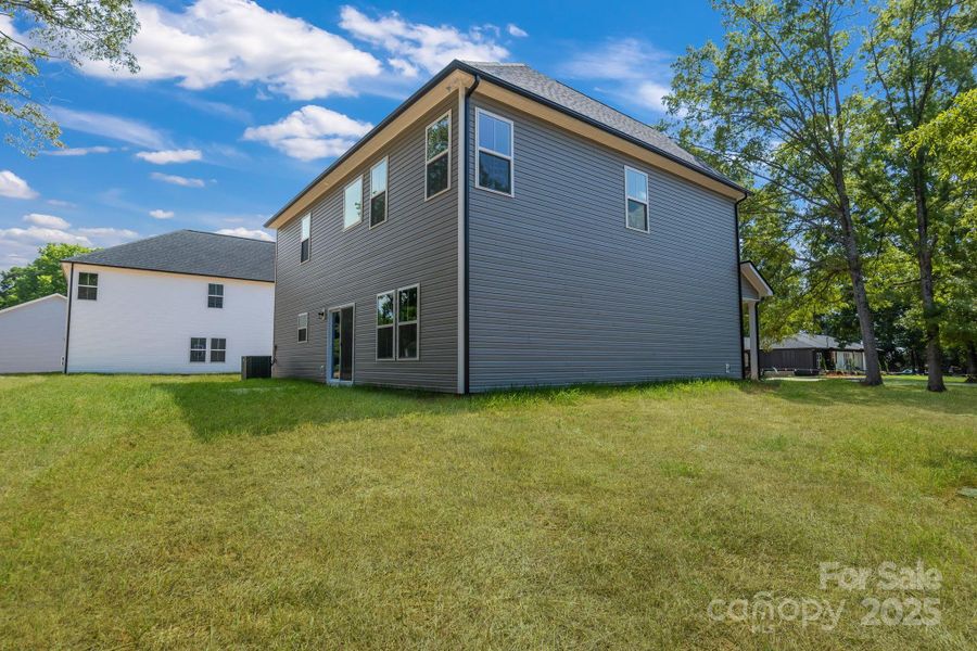 Front exterior of a new home in , Harrisburg, NC, highlighting curb appeal (Image 19).