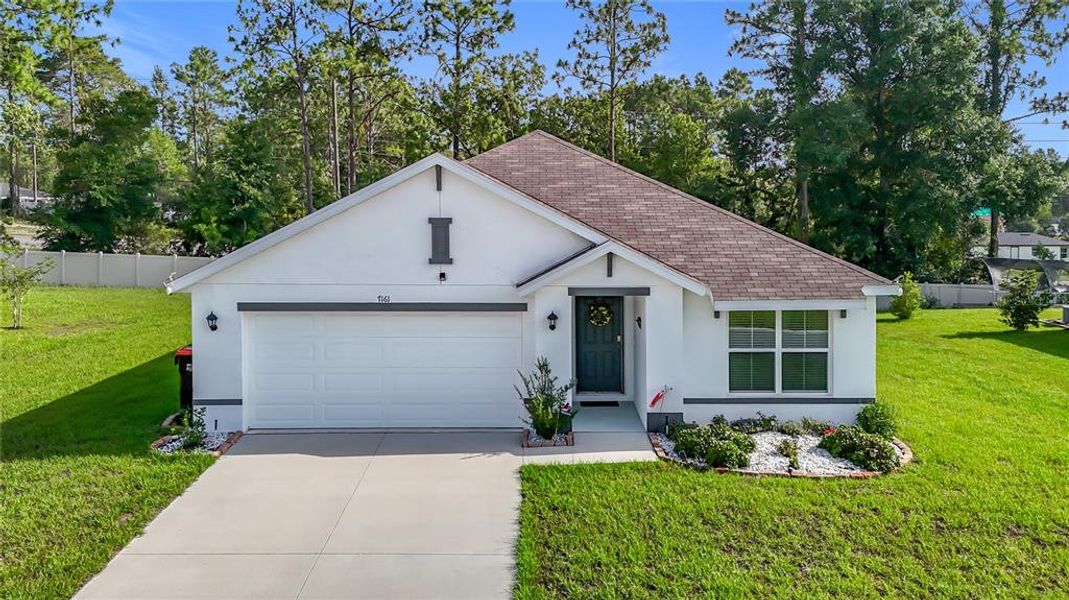 Front exterior of a new home in Huntington Ridge, Ocala, FL, highlighting curb appeal (Image 19).