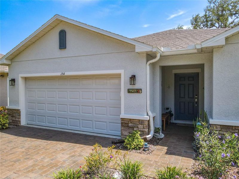Front exterior of a new home in Riverfront, Edgewater, FL, highlighting curb appeal (Image 22).