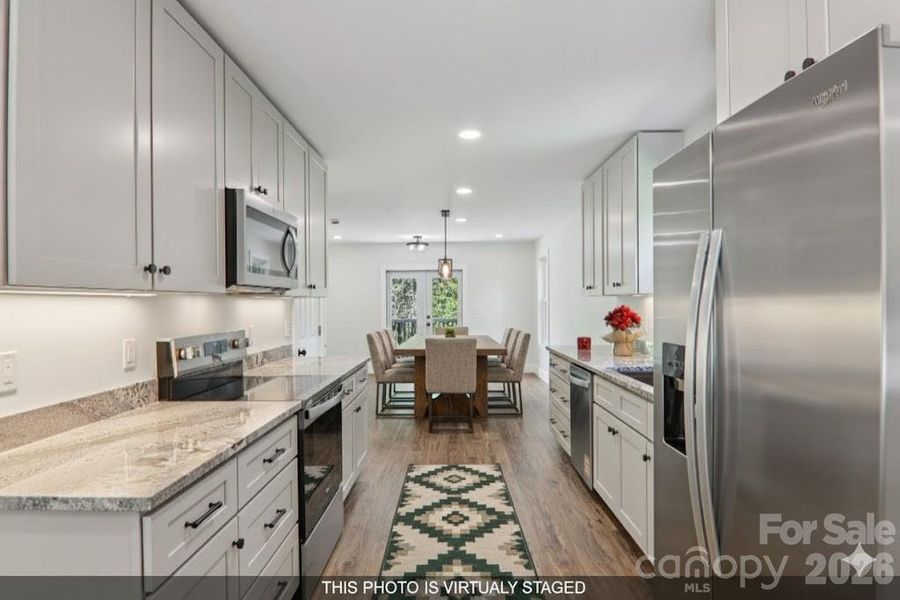 Furnished interior view inside a new home in , Waynesville (Image 17).