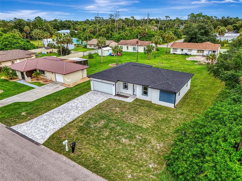 Front exterior of a new home in , Port Charlotte, FL, highlighting curb appeal (Image 20).