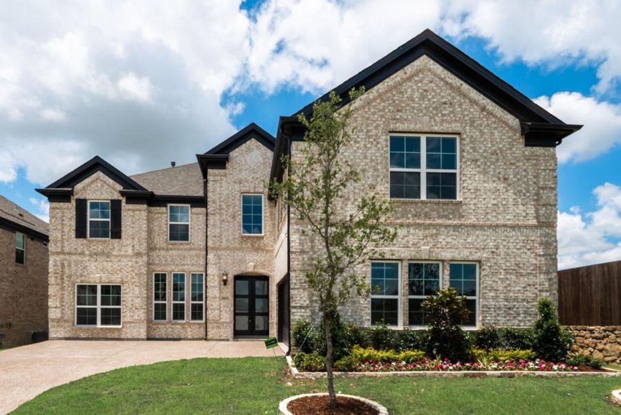 Front exterior of a new home in Buffalo Ridge, Celina, TX, highlighting curb appeal (Image 1). Front exterior of a new home in Buffalo Ridge, Celina, TX, highlighting curb appeal (Image 1).