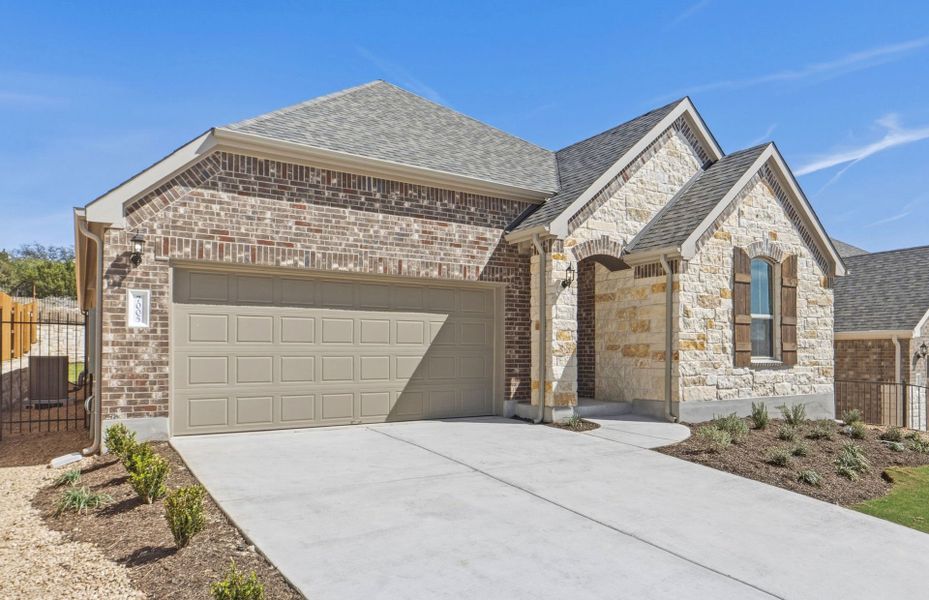 Front exterior of a new home in West Cypress Hills, Spicewood, TX, highlighting curb appeal (Image 21). Front exterior of a new home in West Cypress Hills, Spicewood, TX, highlighting curb appeal (Image 21).