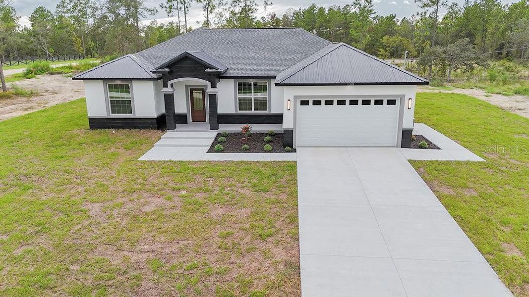 Front exterior of a new home in , Dunnellon, FL, highlighting curb appeal (Image 23). Front exterior of a new home in , Dunnellon, FL, highlighting curb appeal (Image 23).