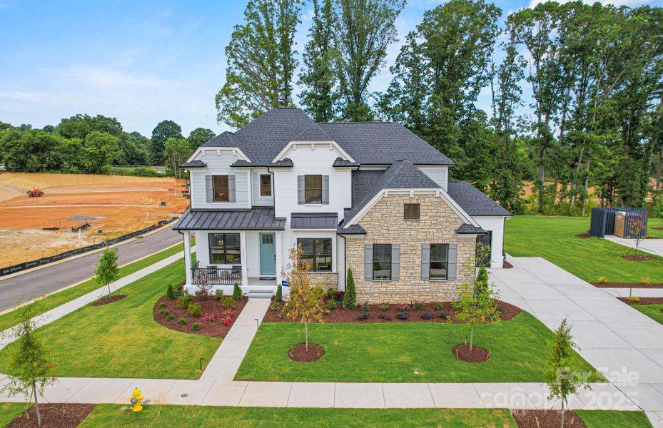 Spacious, fully landscaped corner home site