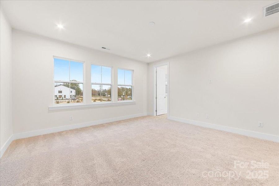 Primary Suite with Large Windows and Unobstructed Views.