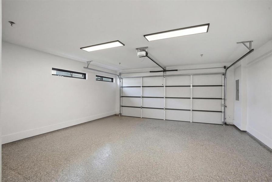 Private attached 2 car garage with epoxy floors and windows for natural light