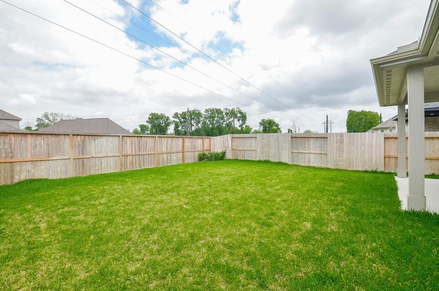 A spacious, fenced backyard perfect for outdoor activities and privacy. Ideal for families or pet owners.